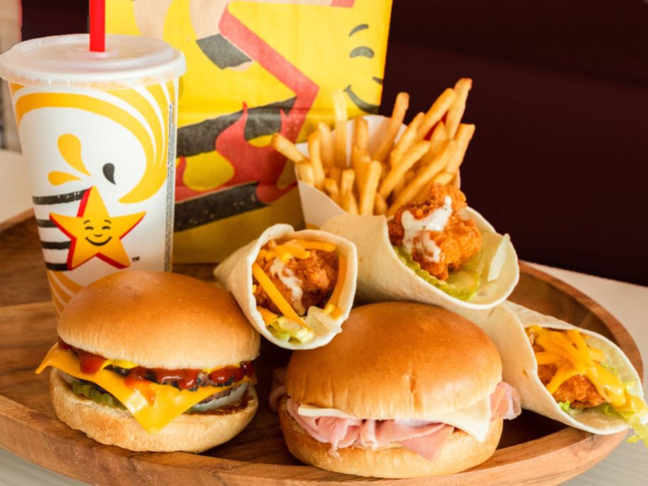 fast food sandwiches, fries and and a drink