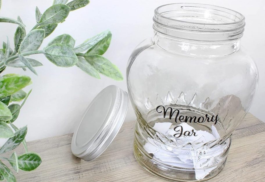 clear memory jar with papers