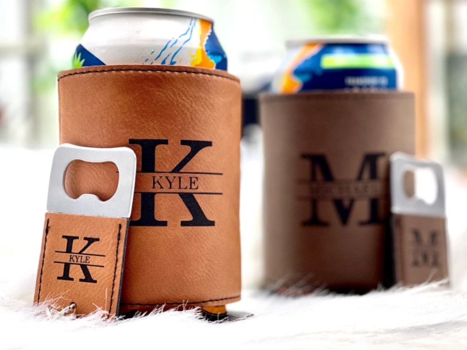 two cans in leather koozies with engraved initials and names on them and matching bottle openers