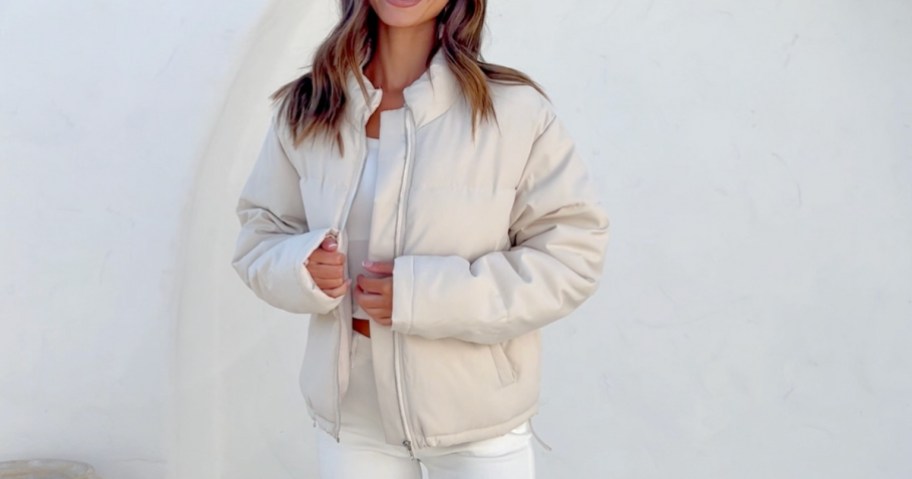 woman wearing cream cropped puffer coat