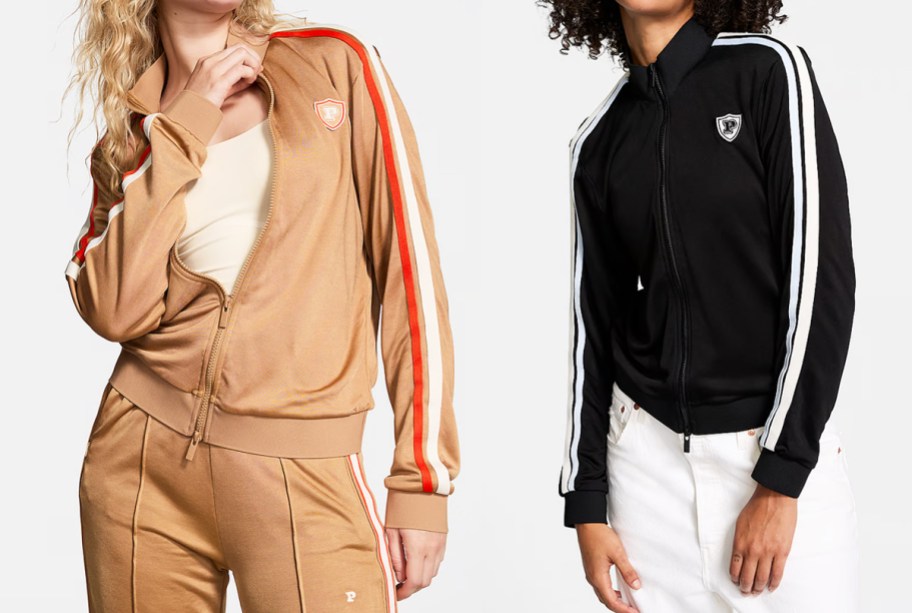 two women in tan and black track jackets