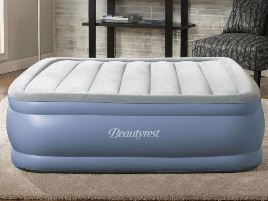 Beautyrest Hi Loft 17" Air Mattress w/ External Pump on floor in living room