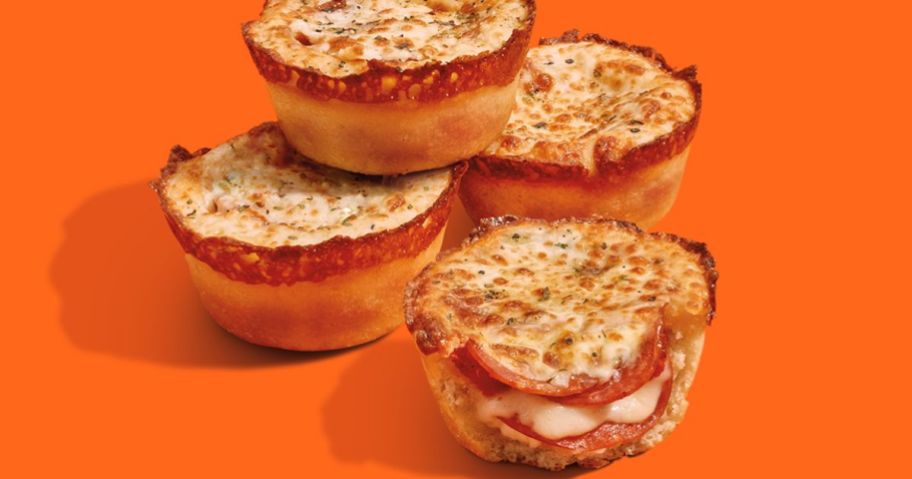 4 little caesars crazy puffs on an orange background