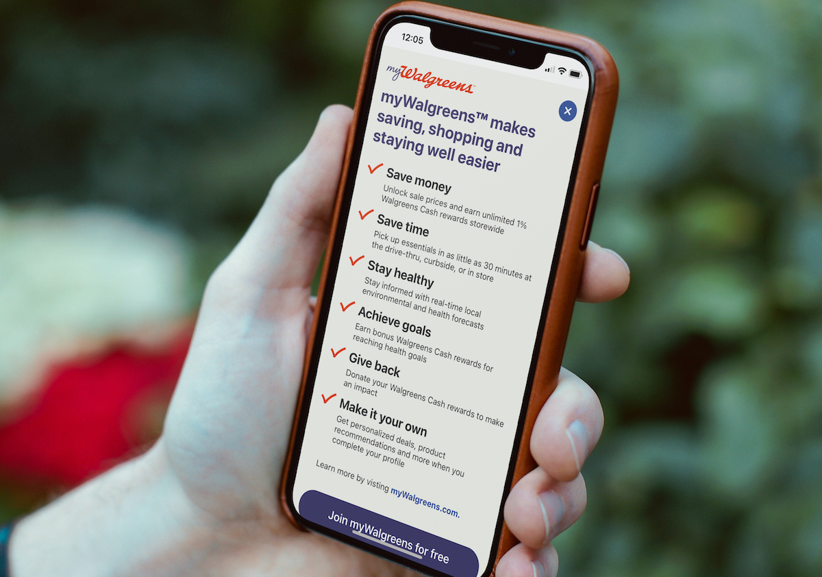 hand holding a phone with myWalgreens app on screen
