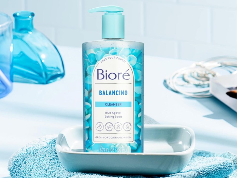 a blue and white bottle of Biore Balance Face Wash on a bathroom counter