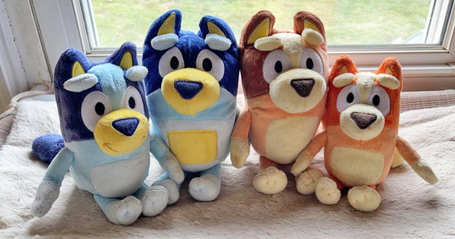 Bluey Heeler Family Plush Set sitting on bed