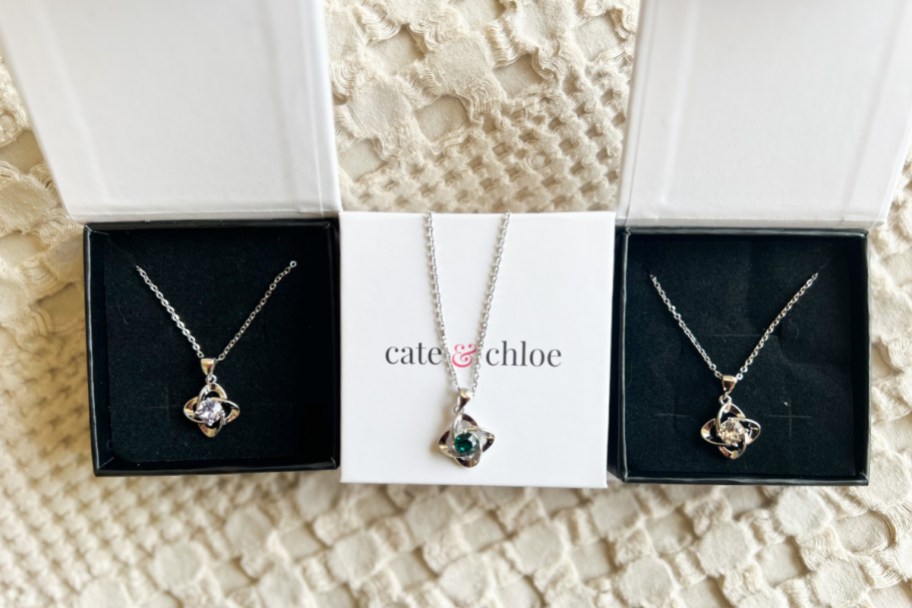 three necklaces in gift boxes 