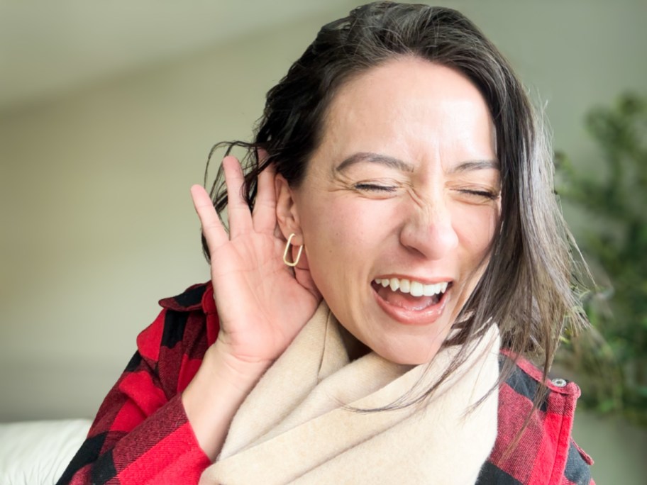 woman wearing square hoop earrings