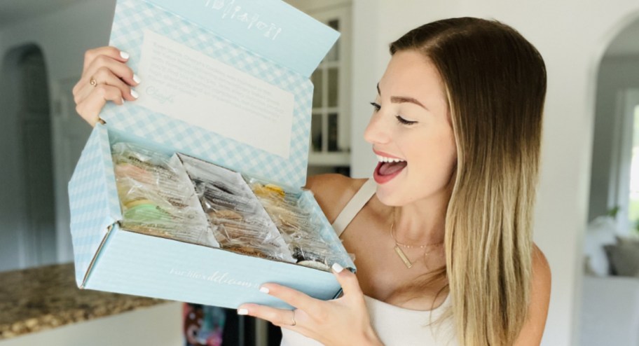 Woman looking at her box of cookies