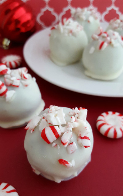 Oreos or Peppermint Oreos are combined with cream cheese and crushed candy canes and then dipped in white chocolate to create Peppermint Oreo Truffles. They’re simple and so delicious.