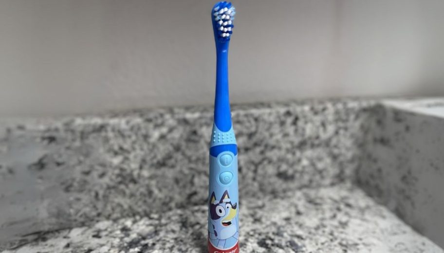 a bluey toothbrush on a bathroom countertop