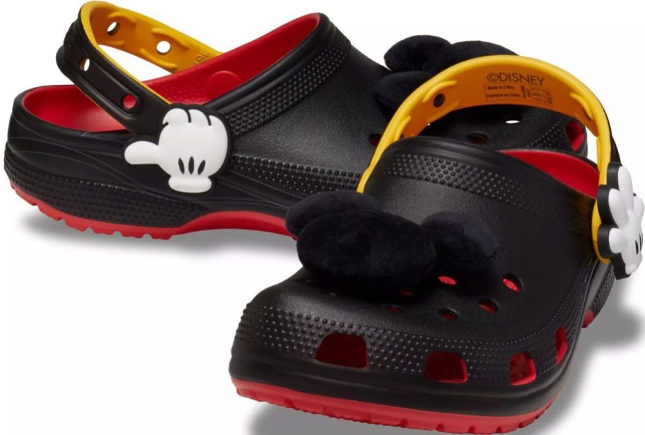 a pair of adult mickey mouse crocs stock image