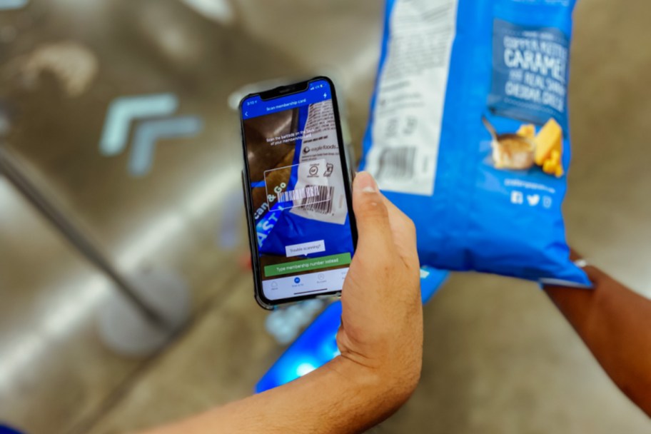 person using the Sam's Club scan and go app on an item in store