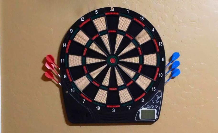 electronic dart board hanging on a wall