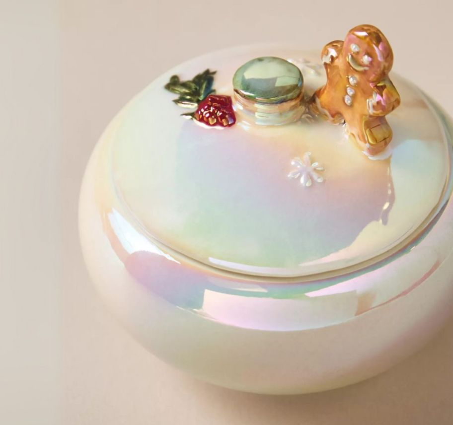 an iridescent candle holder with lid