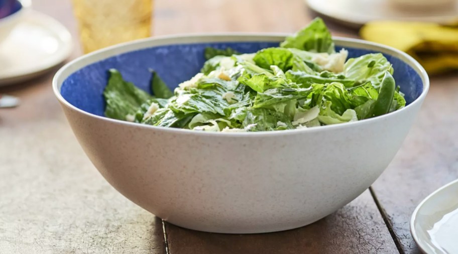 salad in a white and blue serving bowl