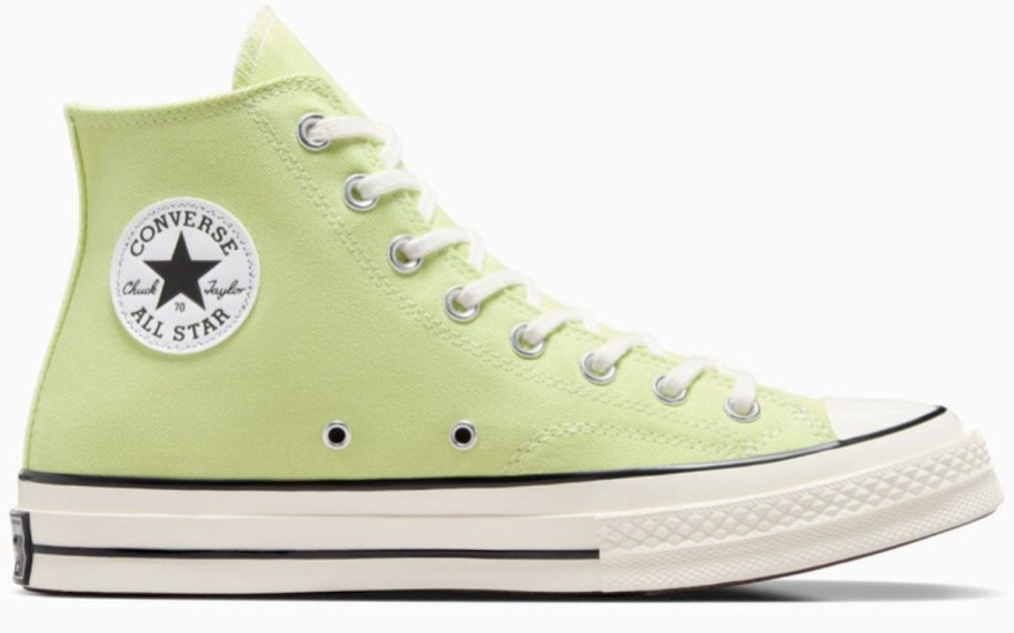 a Converse Chuck Taylor high top shoe in a bright green color