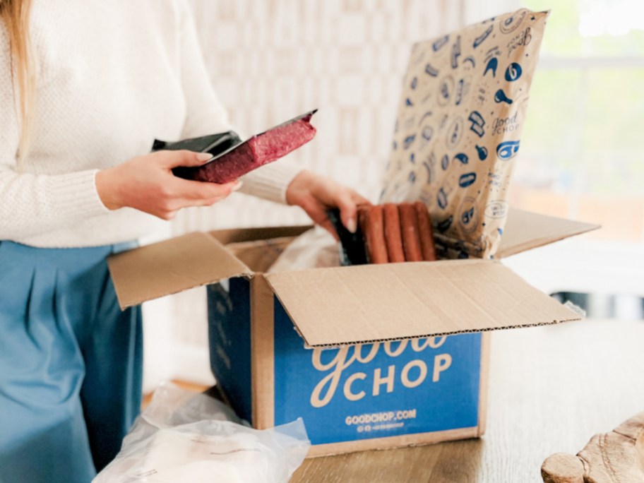 woman unpacking good chop meat delivery box