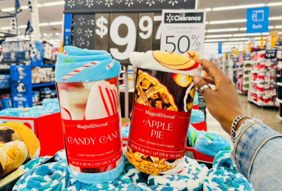 hand resting on <a href='https://online-shopping.fun/shop-smarter-with-amazons-best-selling-products' target='_blank' rel='follow'>top</a> of two packaged scented holiday throw blankets in front of a walmart clearance sign” width=”912″ height=”616″></p>
<p>Head to <a href=