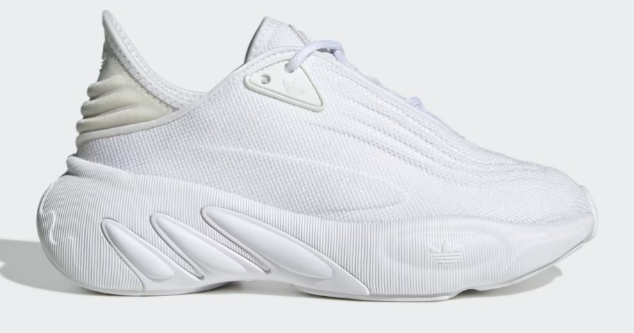 a kids all white adidas tennis shoe