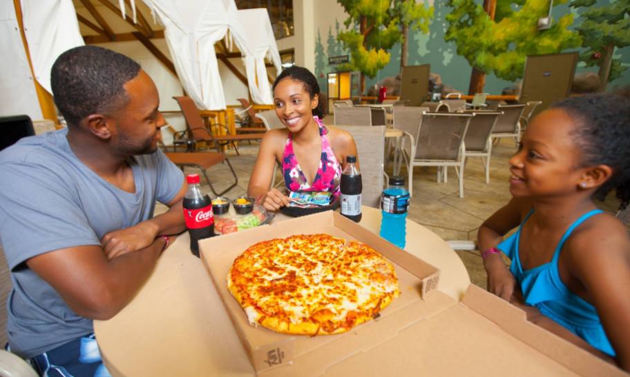 family enjoying pizza at great wolf lodge