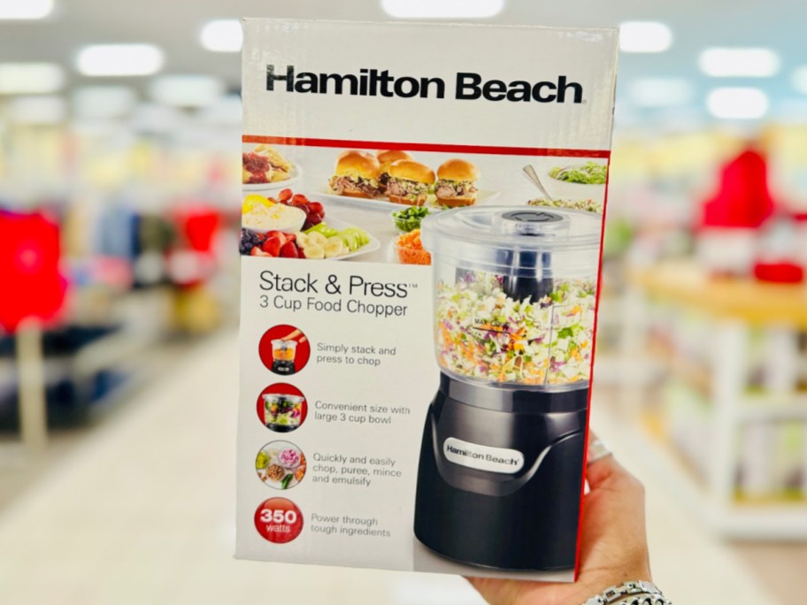 hand holding Hamilton Beach Stack & Press 3-Cup Food Chopper