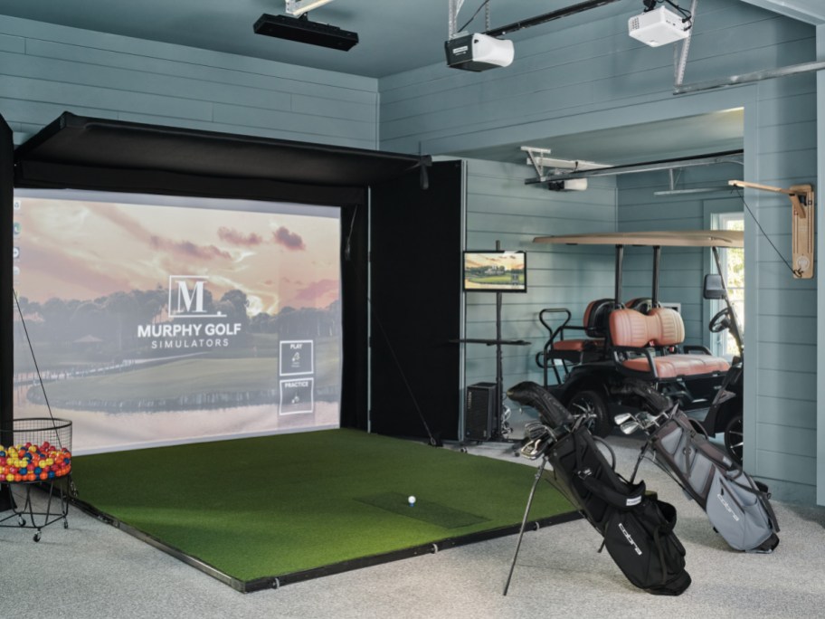 The HGTV Dream Home Garage with a golf swing practice area and golf cart storage