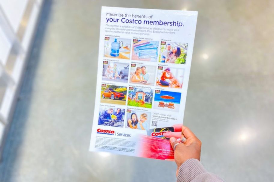 hand holding Costco membership poster