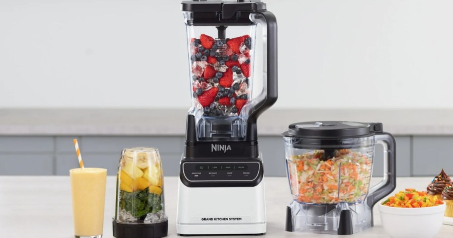 ninja grand kitchen professional blender system with single serve cup and food processor on counter