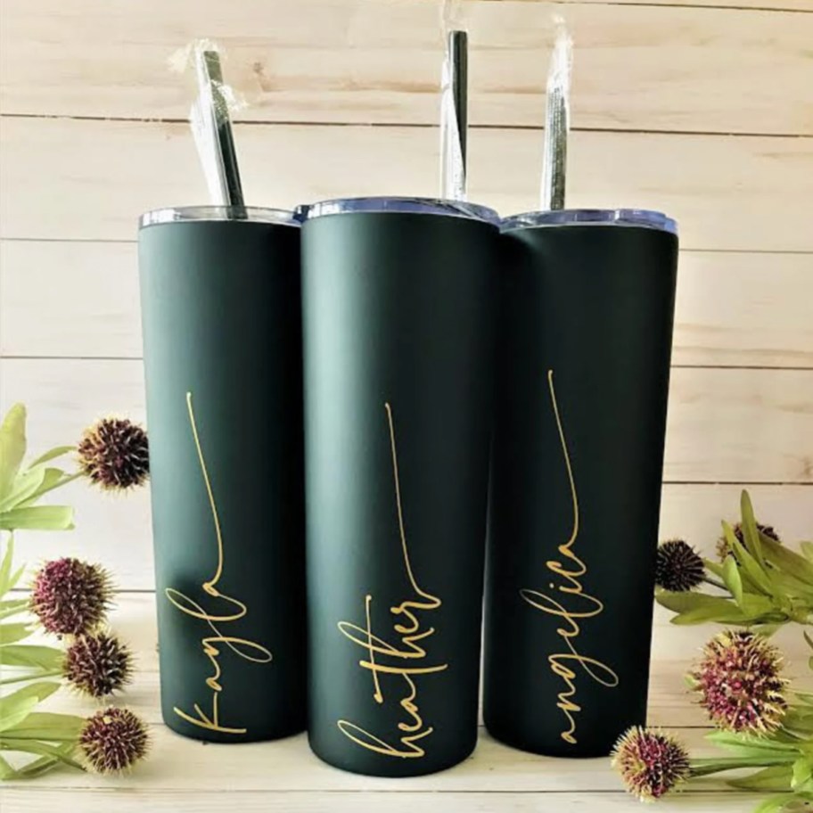 green straw tumblers with gold letters