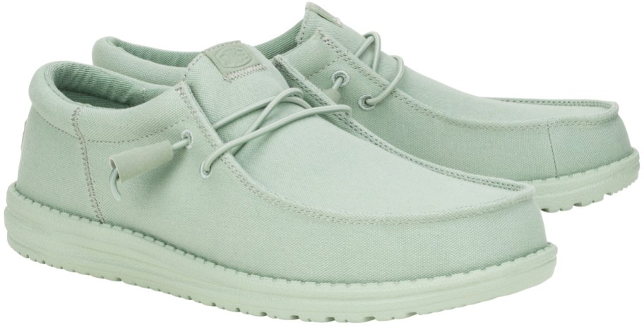 pair of solid light green sneakers