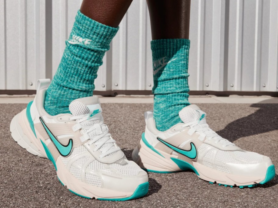 teal socks in white nike shoes