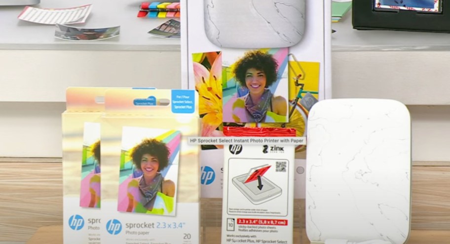 Picture printer with sticky paper packs next to it