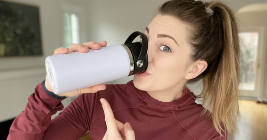 woman drinking from hydro flask wide mouth bottle with flex sip lid