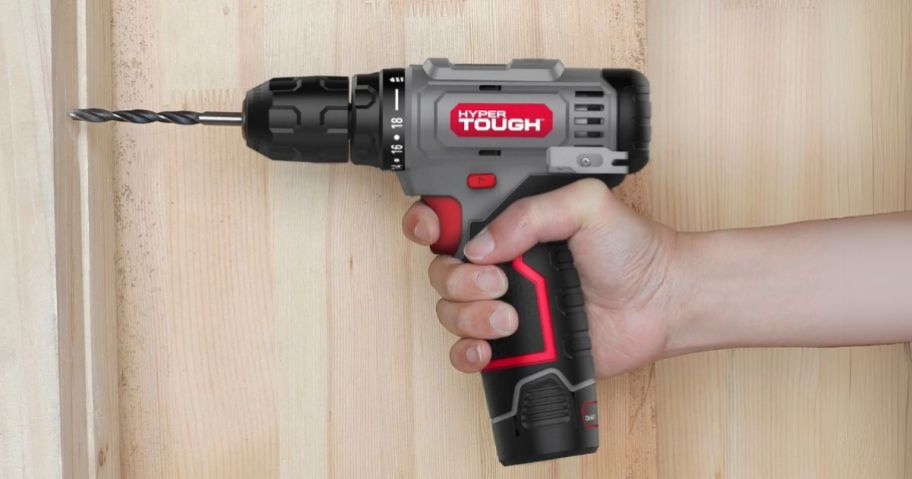 hand using Hyper Tough 12V Max Cordless Drill 