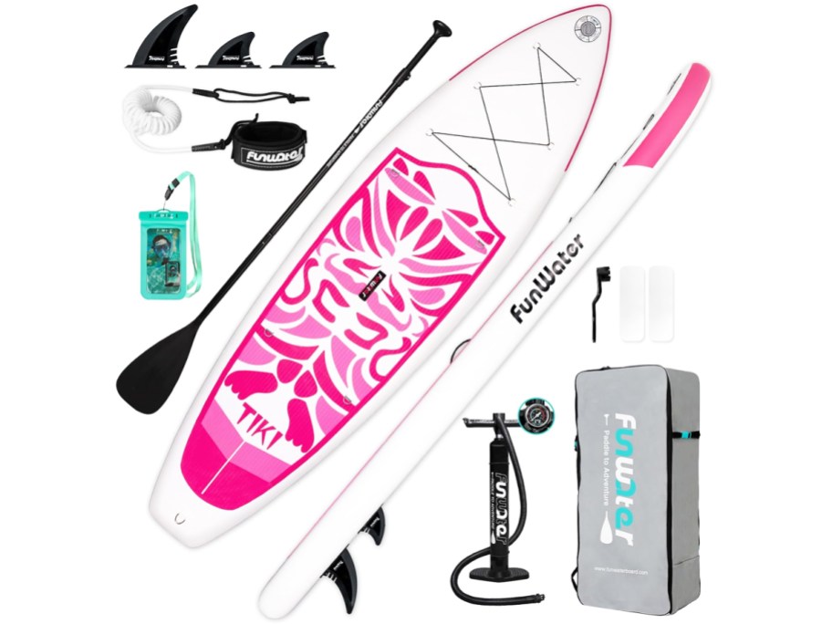 white and pink stand up paddle board surrounded by accessories