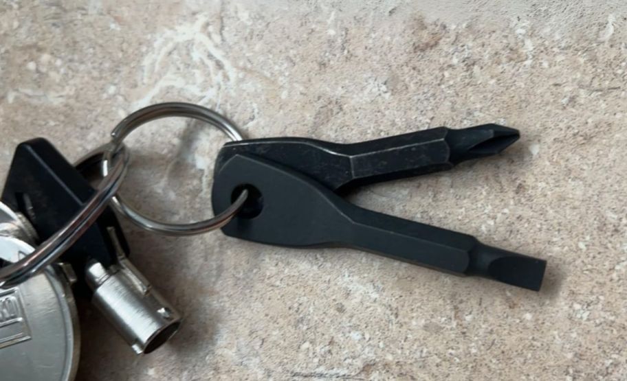 keyring screwdriver set on a ring of keys on a countertop