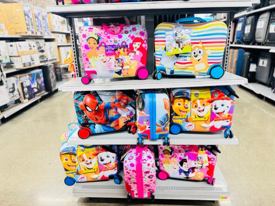 kids ride-on suitcases in a store display