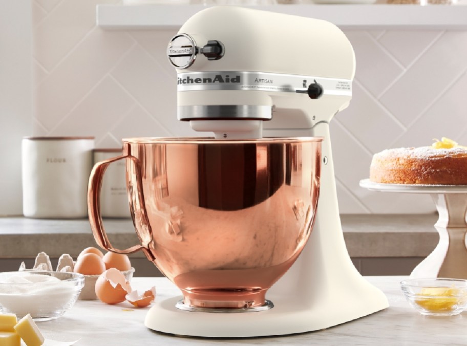 KitchenAid 5qt 10-Speed Stand Mixer w_ Copper Bowl displayed in a kitchen with eggs in the background