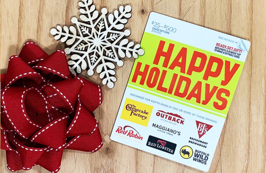 Happy Holidays Dining Gift Card near snowflake and gift bow