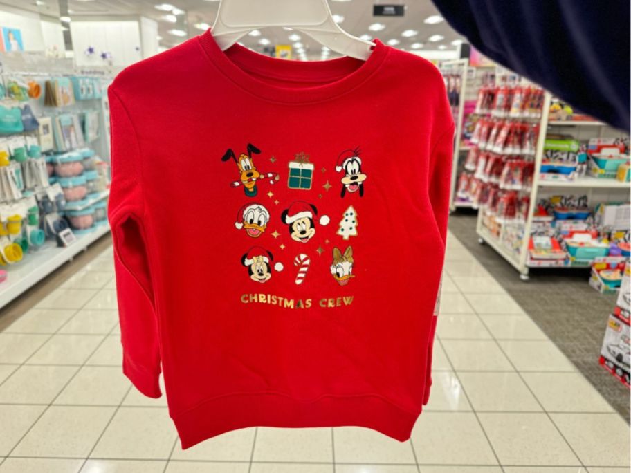 Jumping Beans Disney's Mickey Mouse & Friends Fleece Holiday Graphic Sweatshirt hanging in store