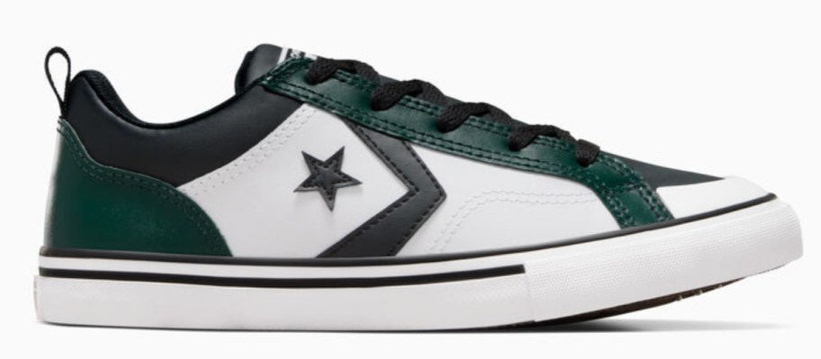 a kids Converse show in white with green and black accents