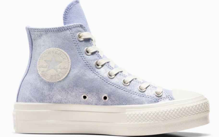 a women's Converse Chuck Taylor high top shoe in a light purple shimmery color with white soles