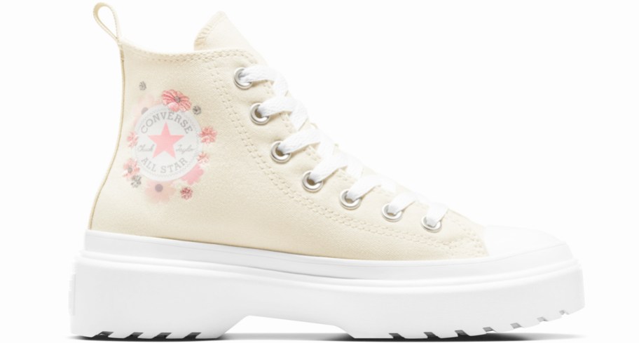 cream colored platform sneaker with pink flowers around chuck taylor logo