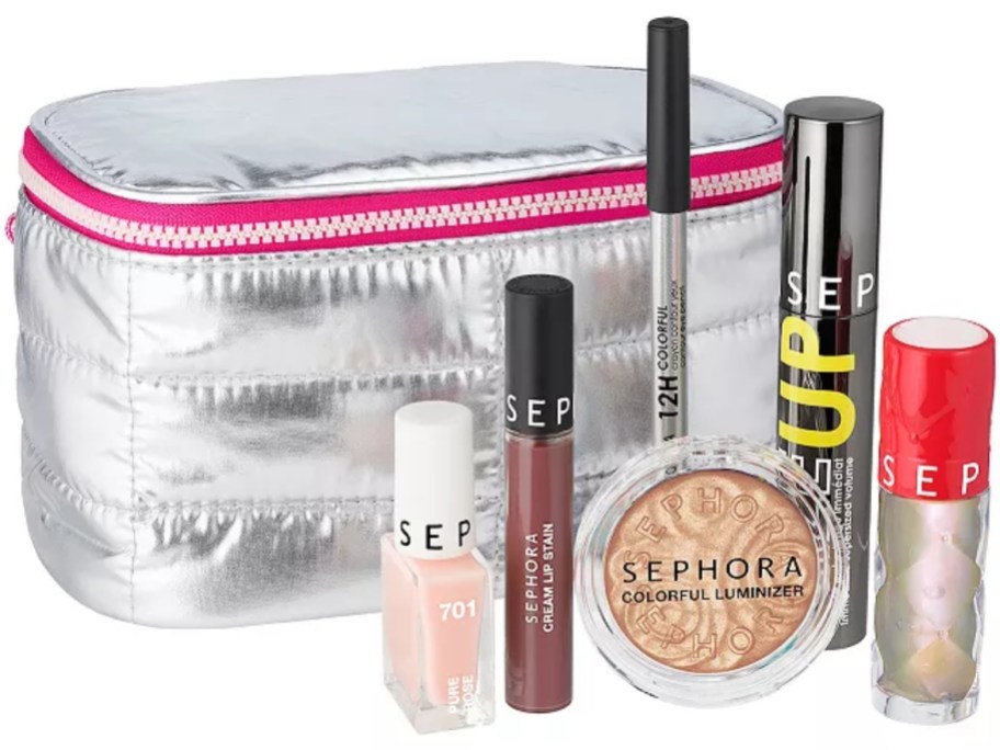 a silver cosmetic bag with makeup items in front of it including lip gloss, eye liner, mascara, bronzer and nail polish