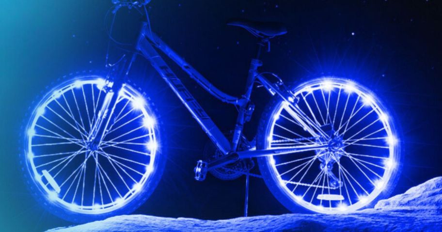 A bike with Brightz WheelBrightz LED Bike Lights on its wheels