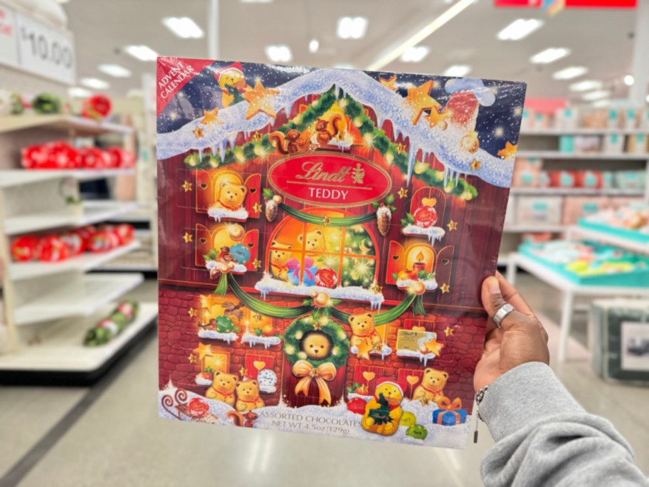 Hand holding a Lindt Advent Calendar from Target