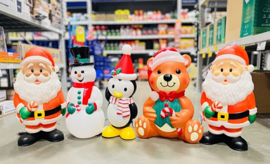  assorted christmas blow molds in a lowes store