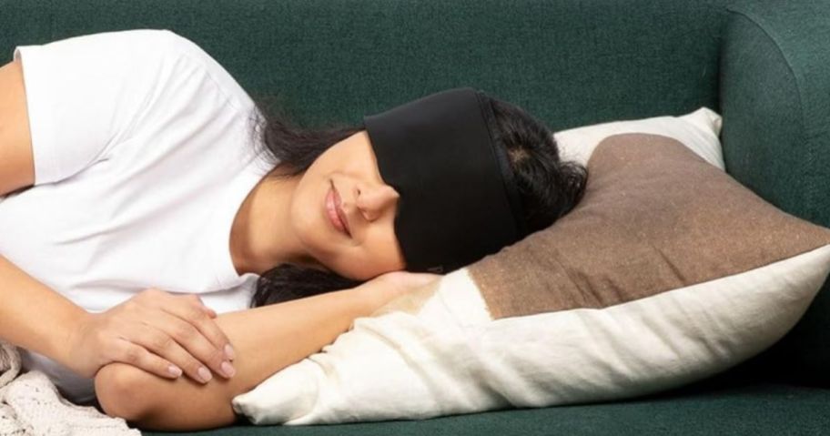 woman wearing Migraine Relief Cap while laying down