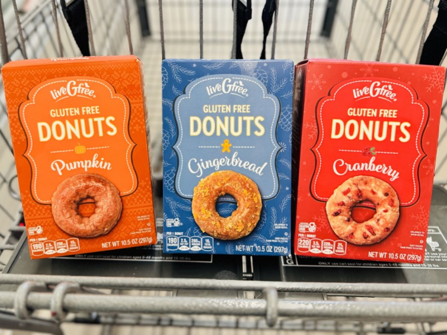 three boxes of gluten free donuts in cart 